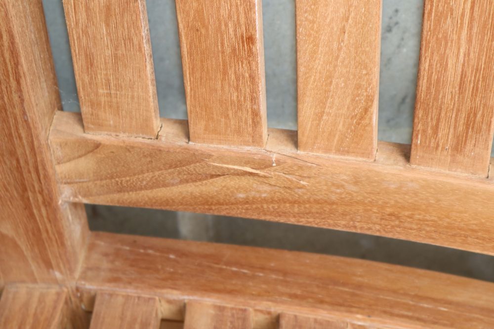 A teak banana garden bench, W.160cm, D.60cm, H.84cm, a.f.